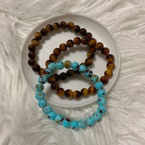 Three brown/blue bead bracelets